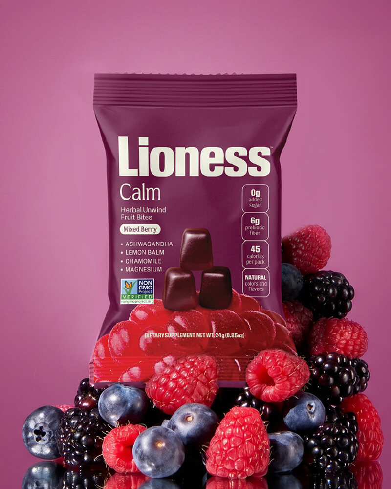 Lioness Calm on a field of mixed berries